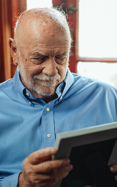 a resident looking at old photos of loved ones