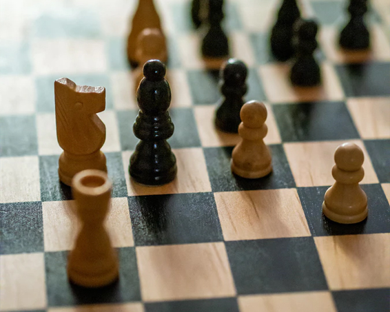 a chess board with chess pieces 