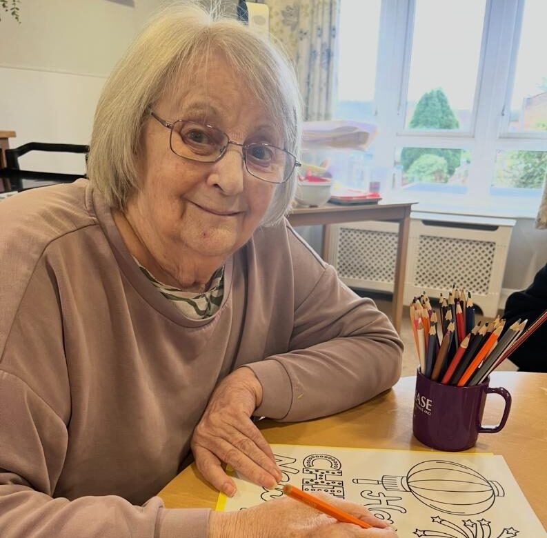 resident doing arts and crfts