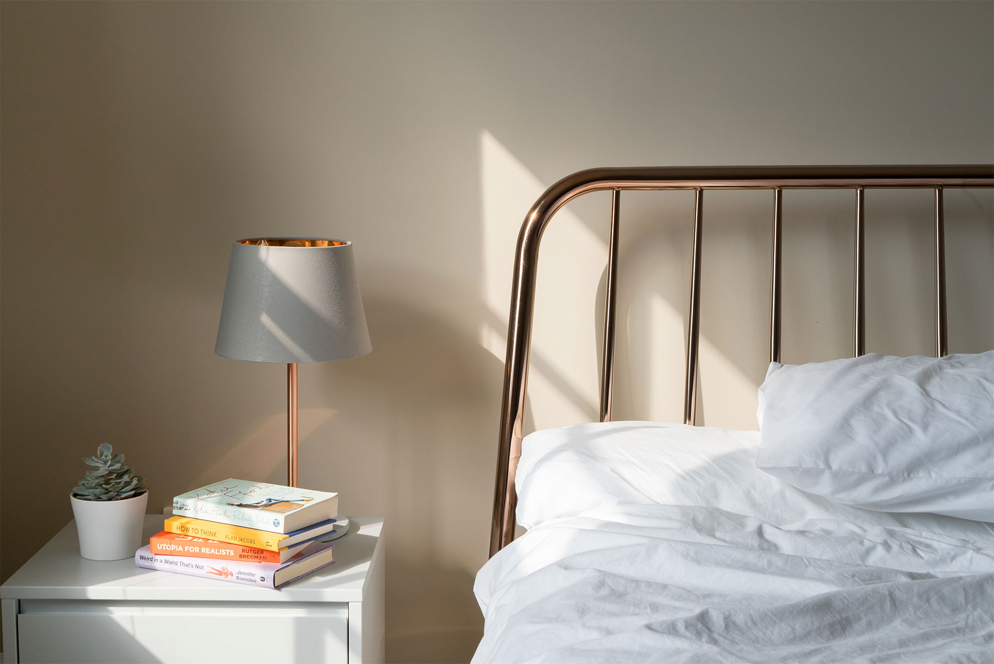 a bed and bedside table