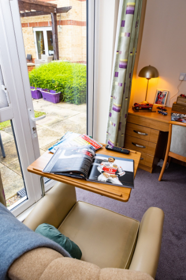 Bedroom armchair with magazines