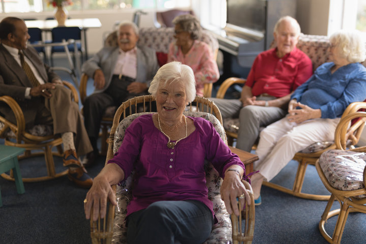 residents together in lounge smiling