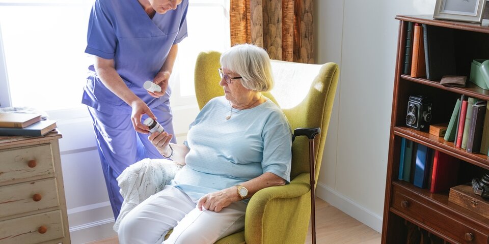 resident receiving medication from nurse